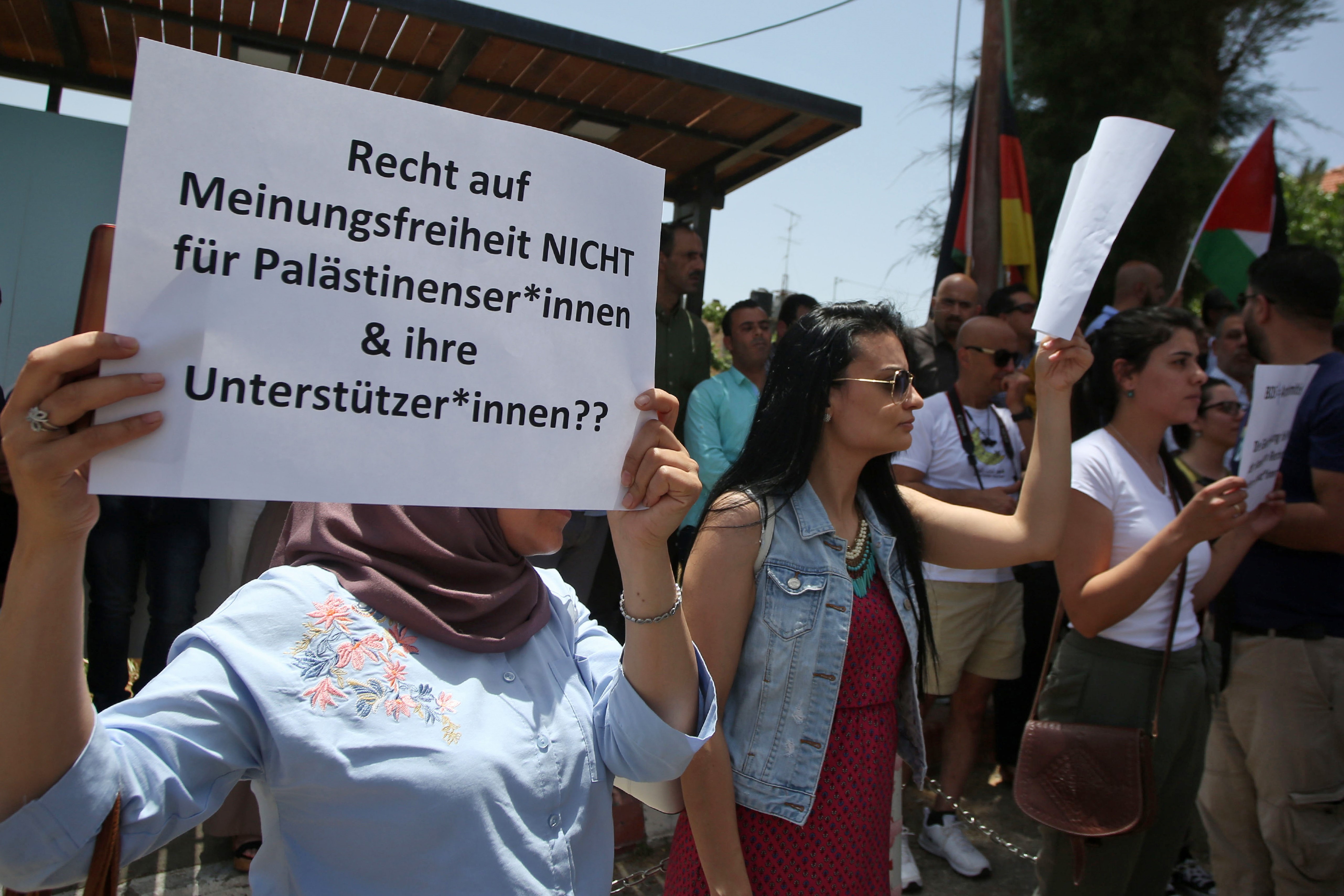 Protesters stage a demonstration outside Germany's Representative Office in Ramallah in the Palestinian West Bank on May 22, 2019, following the Bundestag's (German parliament) condemnation of the Boycott, Divestment, Sanctions (BDS) movement as anti-Semitic.