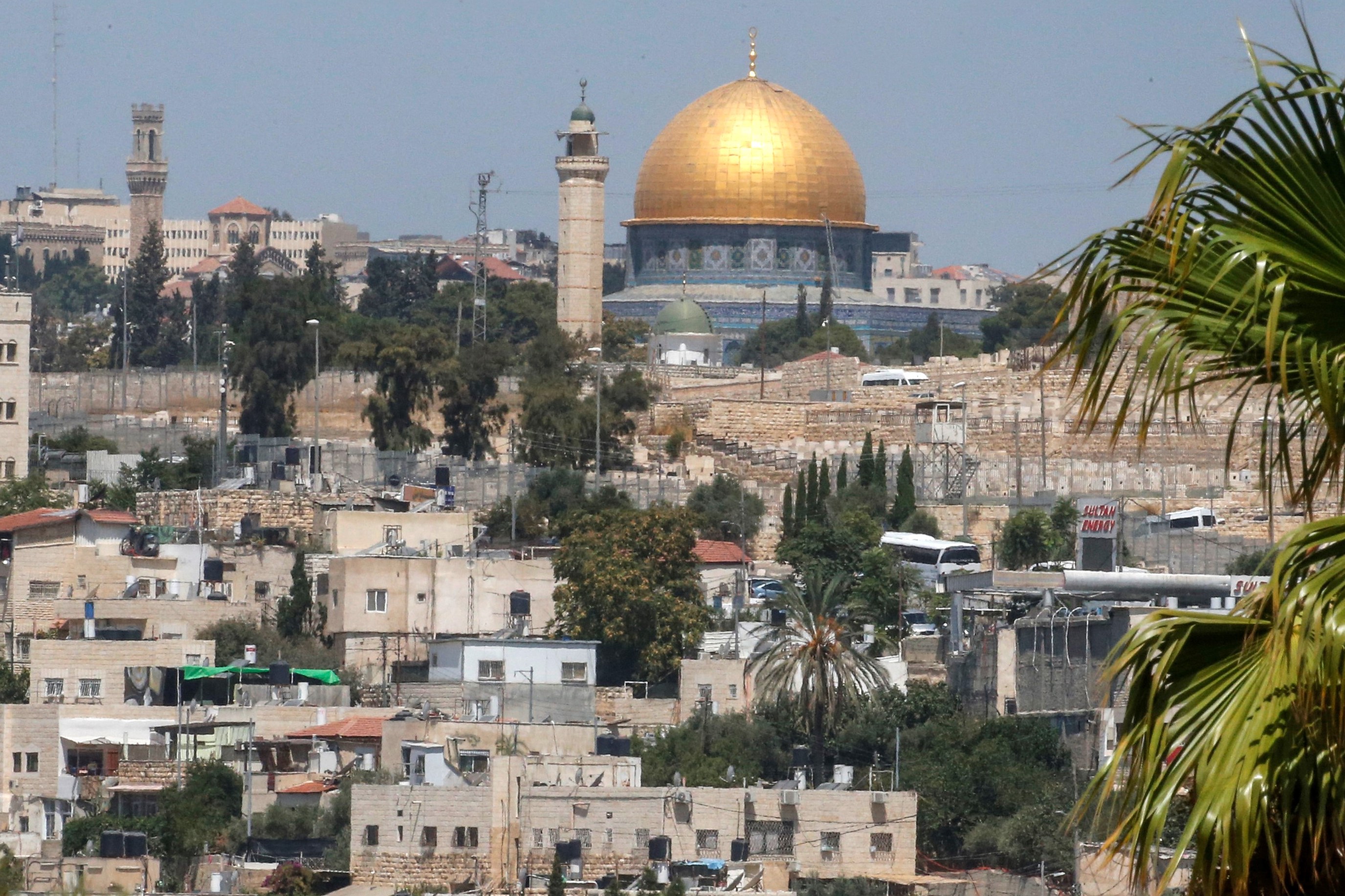 This picture taken on August 16, 2019 from the West Bank town of Eizariya, also known as the Biblical town of Bethany, shows a view of Jerusalem with the Dome of the Rock seen in the backgroun