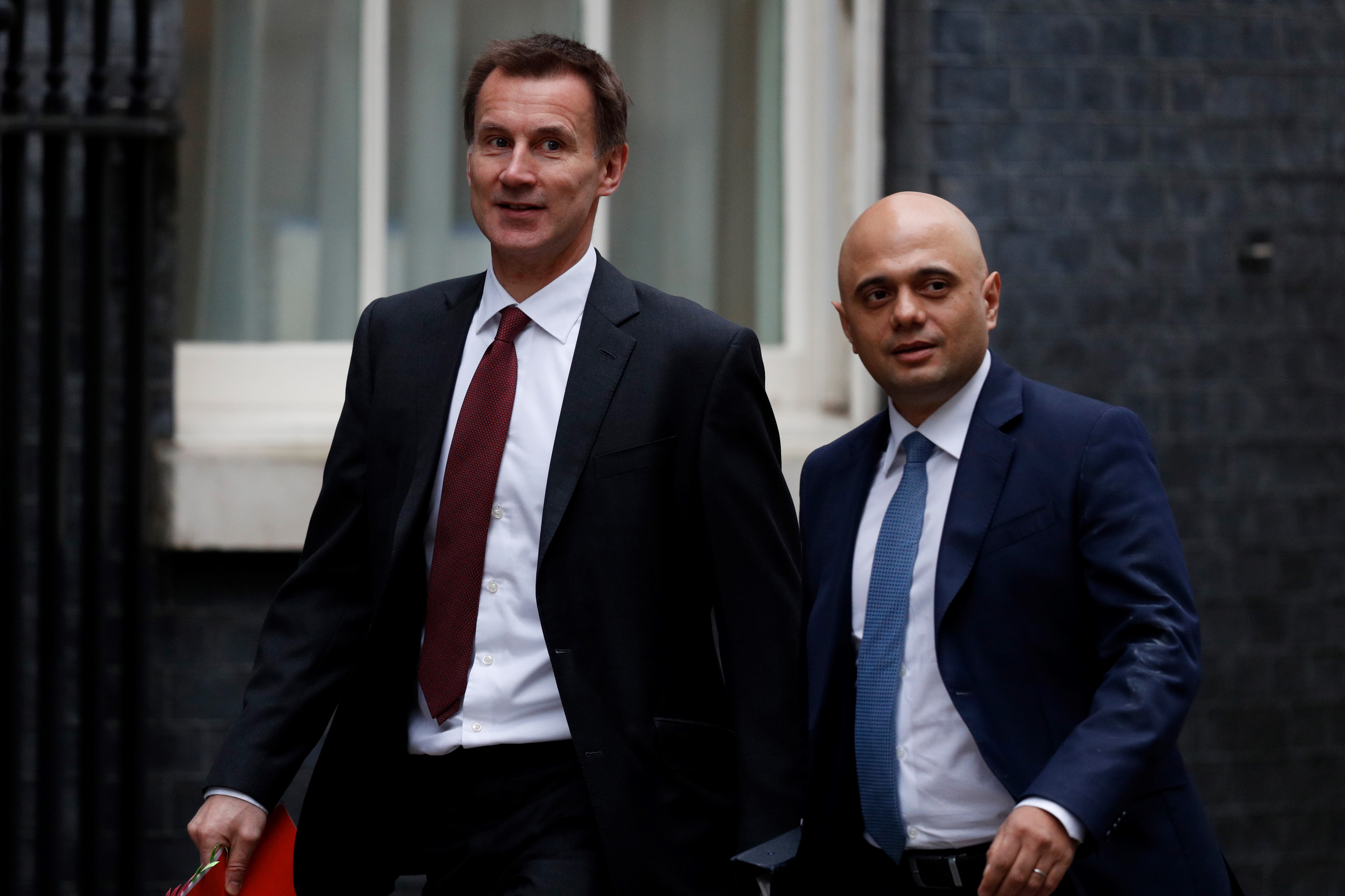 Britain's Foreign Secretary Jeremy Hunt (L) and Britain's Home Secretary Sajid Javid arrive for the weekly cabinet meeting at 10 Downing street in London on 15 January, 2019 (AFP)
