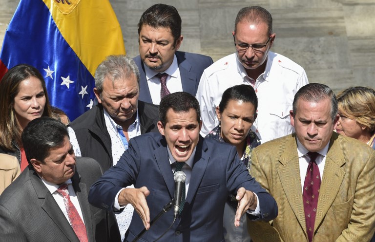 Venezuela's self-proclaimed acting president, Juan Guaido, speaks to the media in Caracas on 4 February (AFP)