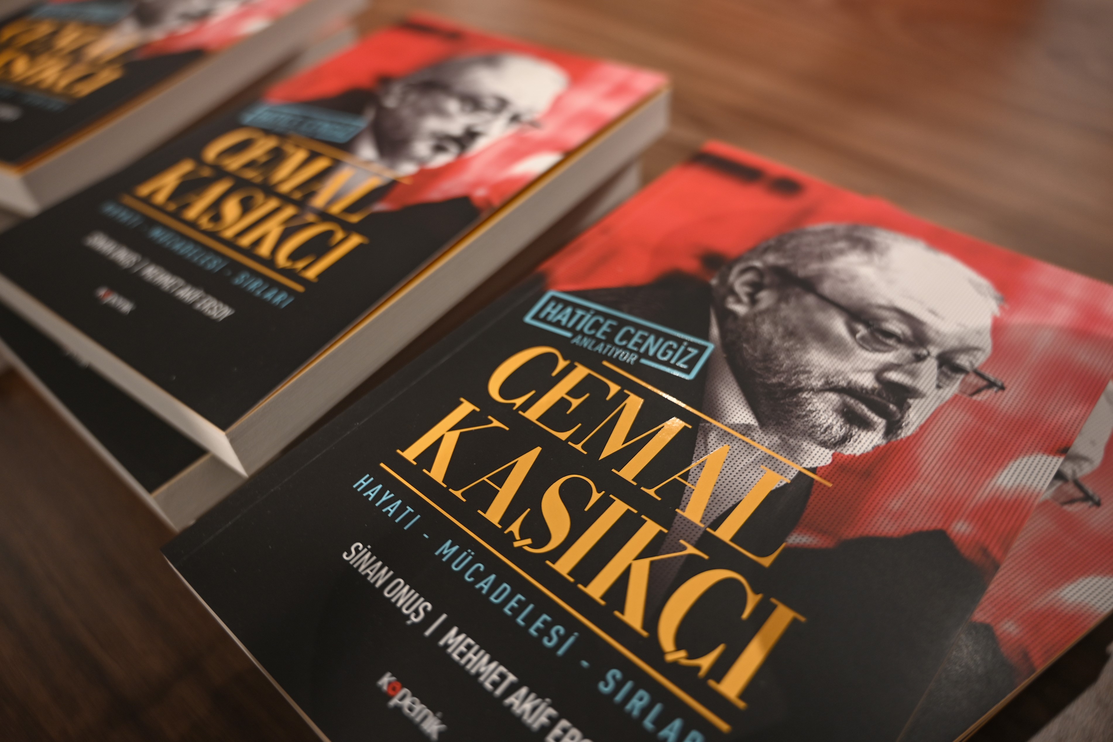 Books dedicated to the murdered the Saudi journalist Jamal Khashoggi, written by his partner Hatice Cengiz, are displayed during a presentation in Istanbul on 8 February (AFP)
