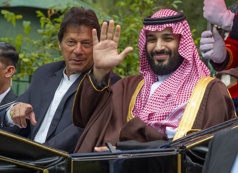 Khan and MBS ride in a carriage in Islamabad on 18 February (Bandar al-Jaloud/Saudi Royal Palace/AFP)