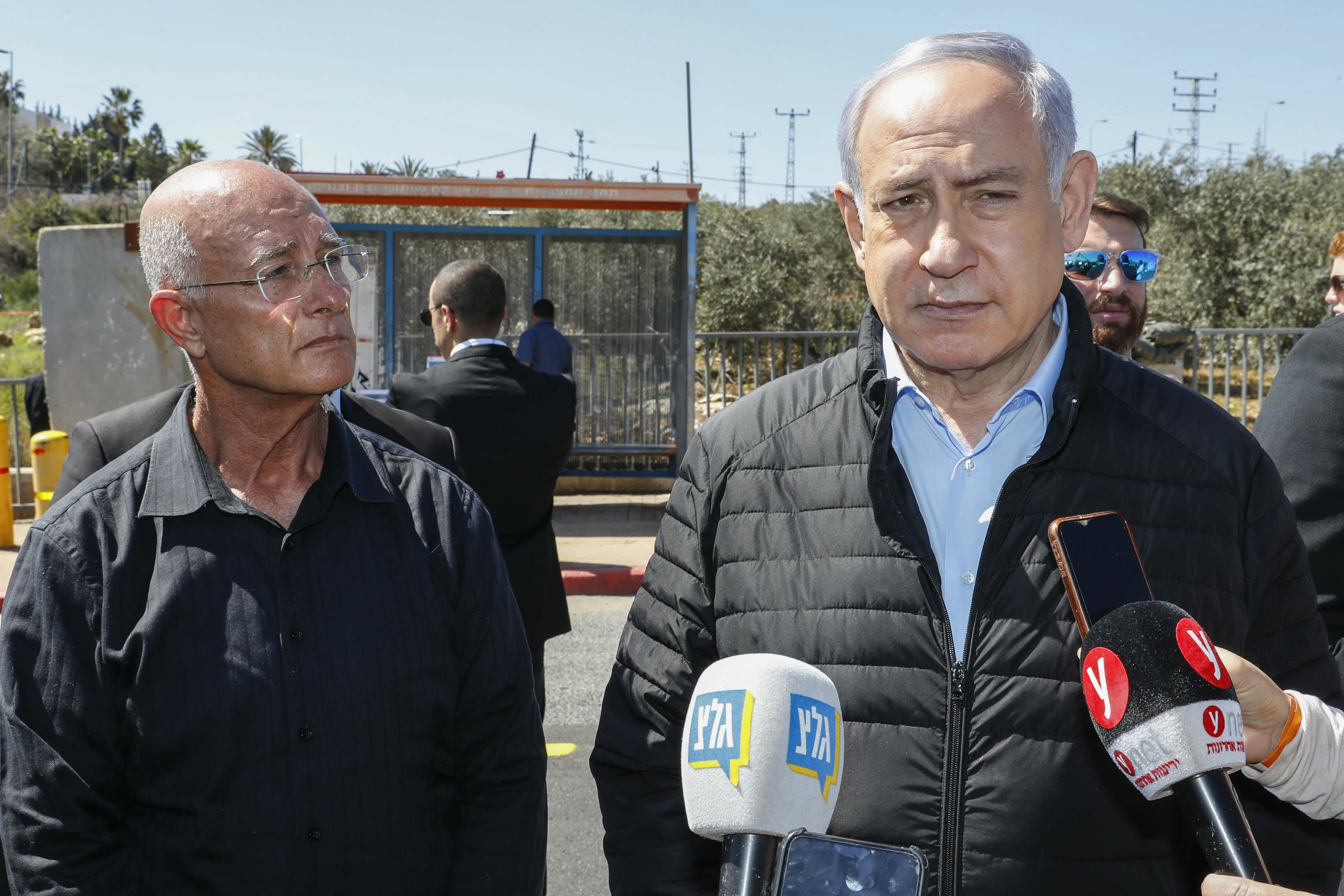 Israeli Prime Minister Benjamin Netanhayu arrives at the scene of gun and knife attack, carried out by a Palestinian the previous day, at the Ariel junction (AFP)
