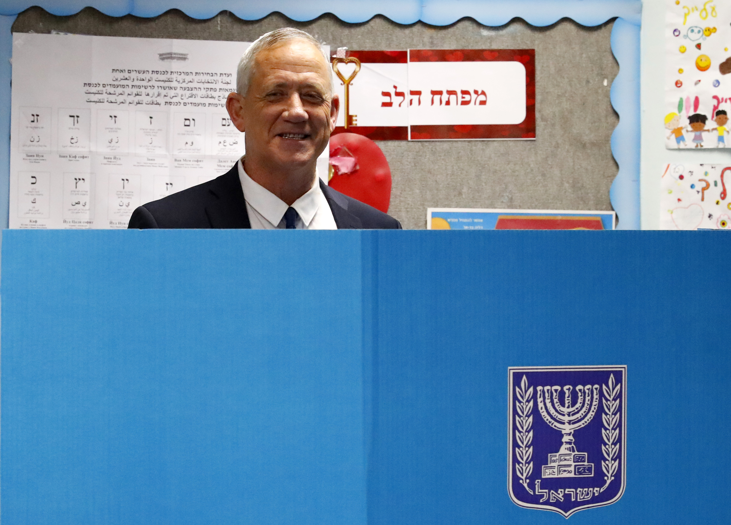 Retired Israeli general Benny Gantz, one of the leaders of the Blue and White (Kahol Lavan) political alliance, casts his vote (AFP)