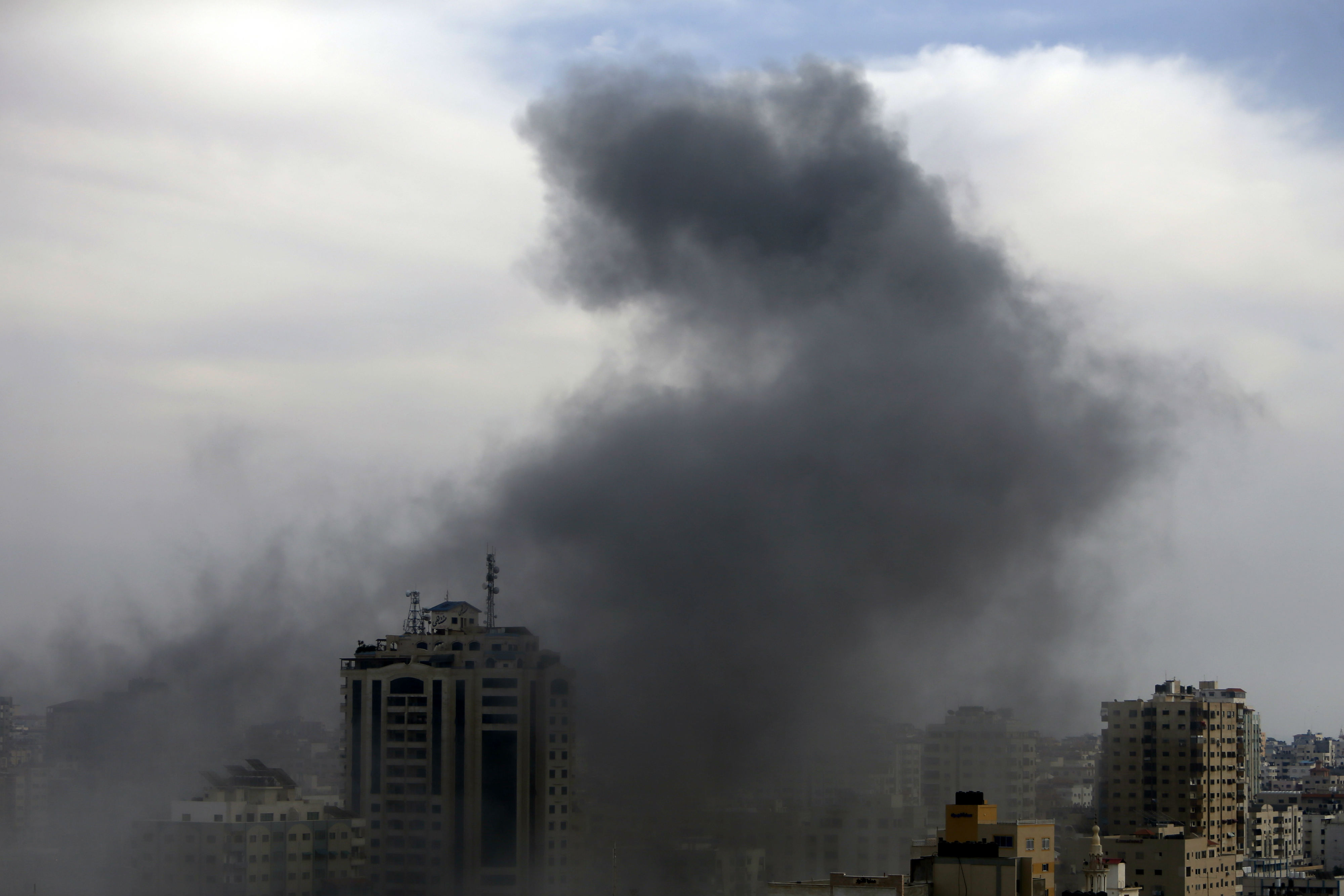 Smoke billows from a targeted neighbourhood in Gaza City during an Israeli airstrike on the Palestinian enclave (AFP)