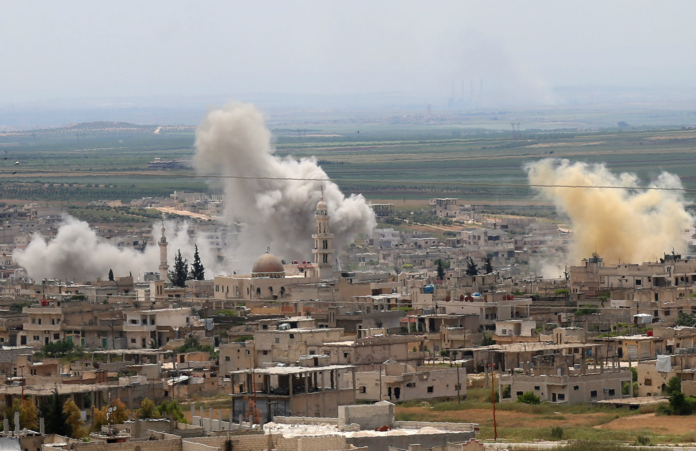 Smoke billows following reported Syrian government forces' bombardment in the town of Khan Sheikhoun (AFP)