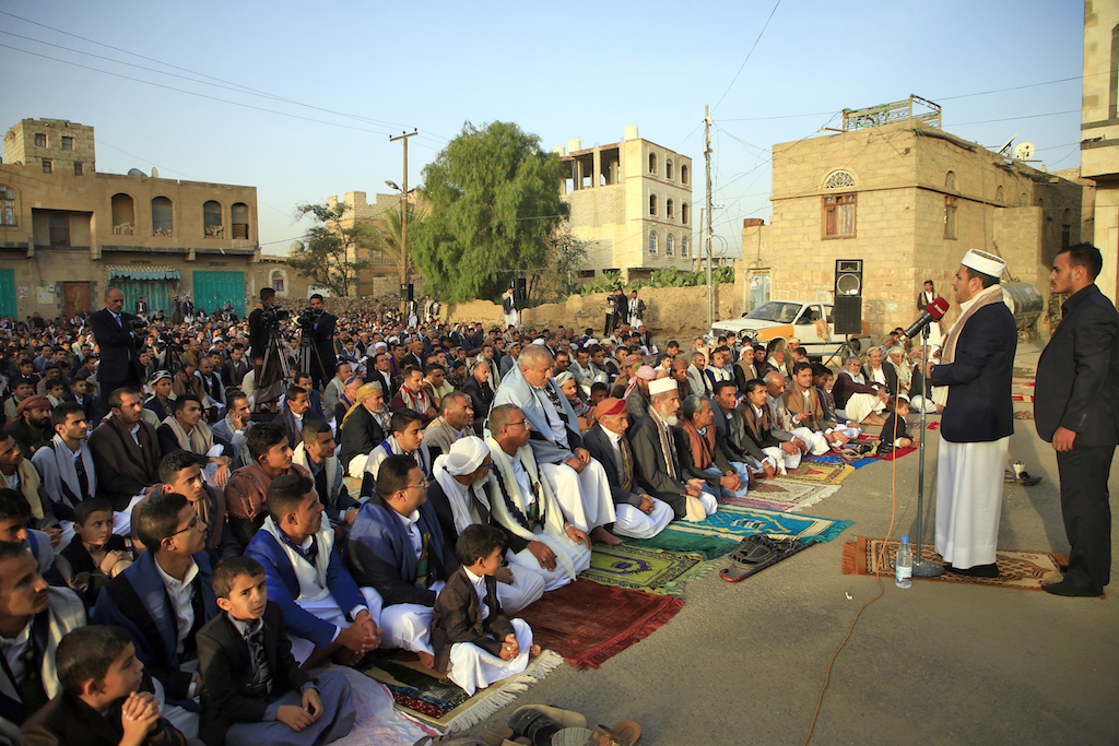 Yemeni Muslim worshippers perform Eid al-Fitr prayers at a square in the capital Sanaa (AFP)