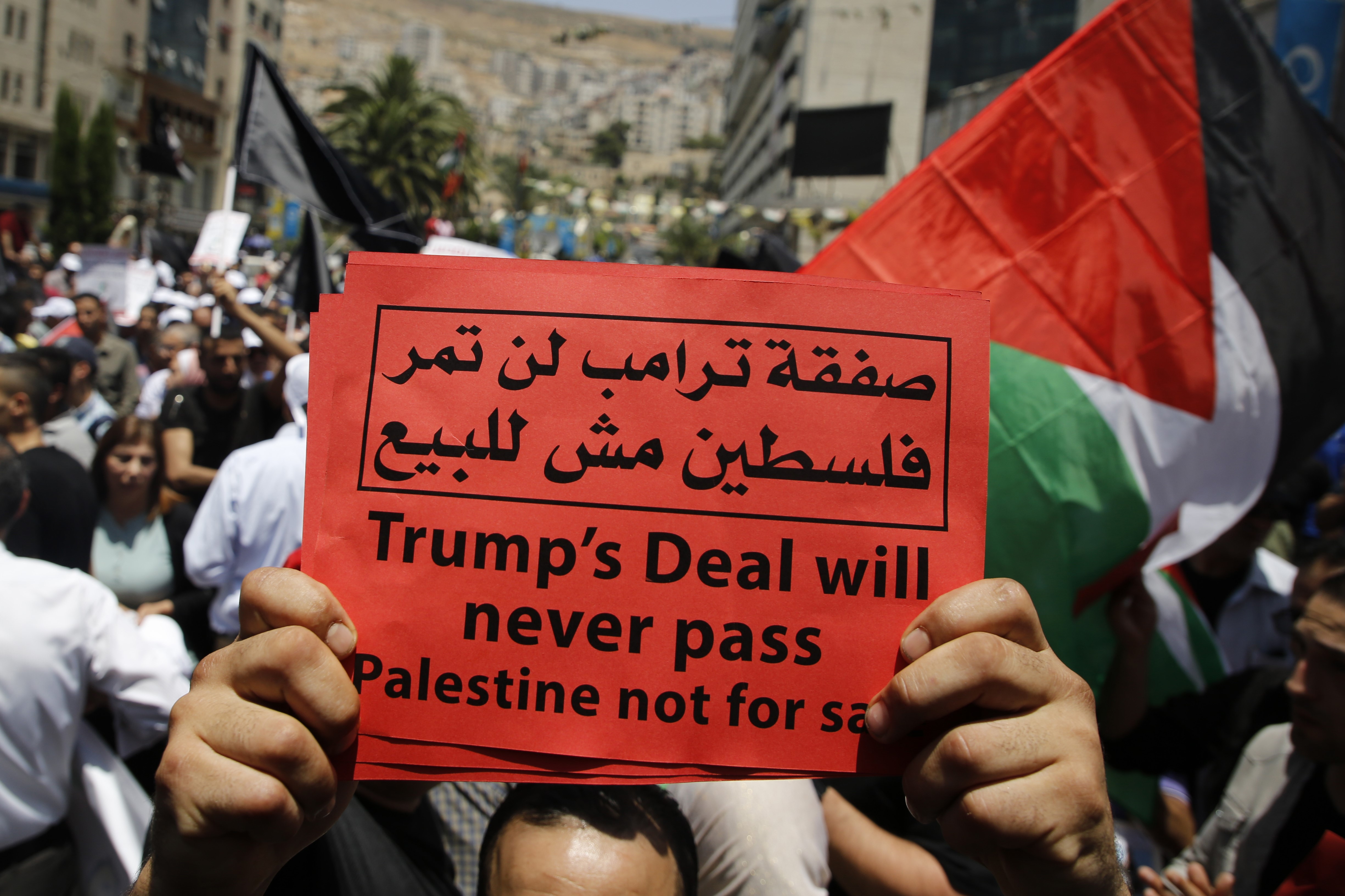 Palestinian in Nablus demonstrate against the US-sponsored Middle East economic conference on 25 June (AFP)
