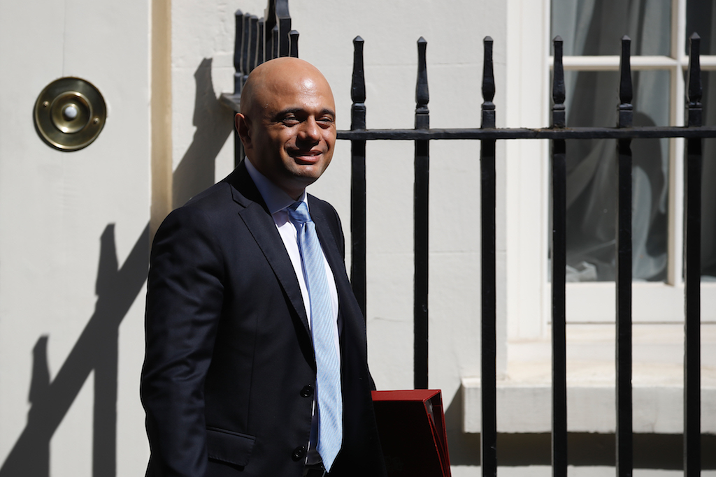 Britain's Chancellor of the Exchequer Sajid Javid leaves 11 Downing street on his way to the Houses of Parliament in London (AFP)