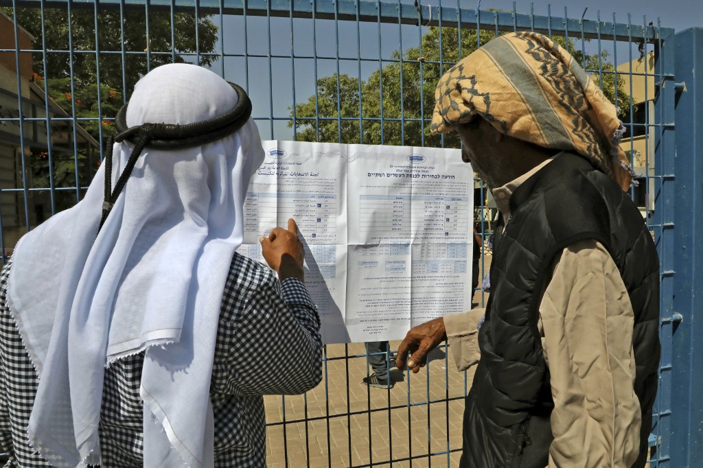 Bedouins from the Negev register to vote outside a polling station in Beersheva in southern Israel during the Jewish state's parliamentary election (AFP)