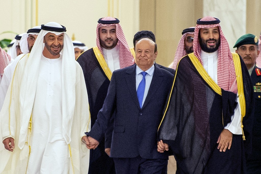 Emirati Crown Prince of Abu Dhabi Sheikh Mohamed bin Zayed al-Nahyan walks with Hadi and Saudi Crown Prince Mohammed bin Salman in Riyadh in November 2019 (AFP)