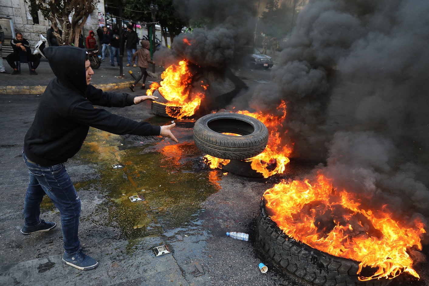 Protesters in Beirut burn tyres on 22 January (AFP)
