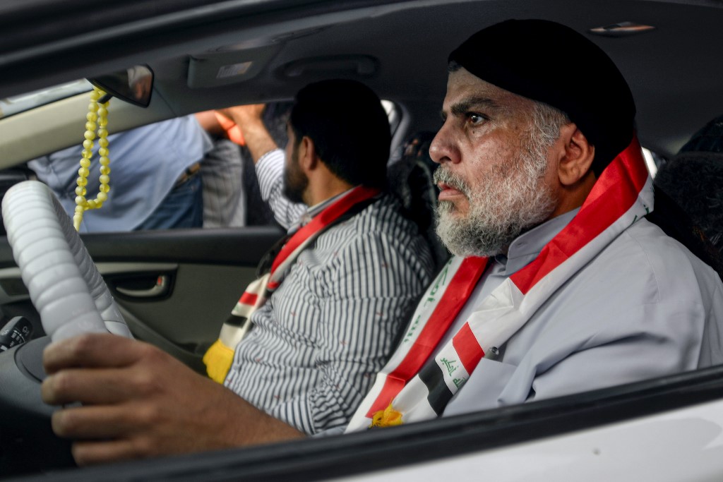 In October, Muqtada al-Sadr joins anti-government demonstrators in Najaf (AFP)