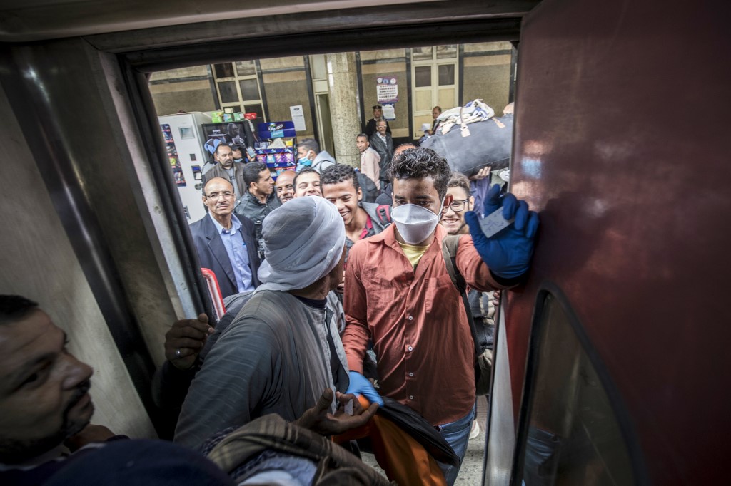 Passengers board a train at Cairo's Ramses railway station earlier this month (AFP) 