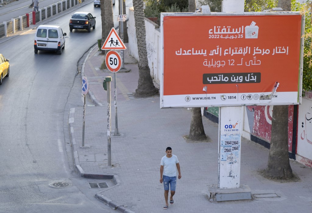 A picture taken on 21 July 21, 2022, shows a billboard in the capital Tunis, encouraging Tunisians to vote on the upcoming constitutional referendum. (AFP)