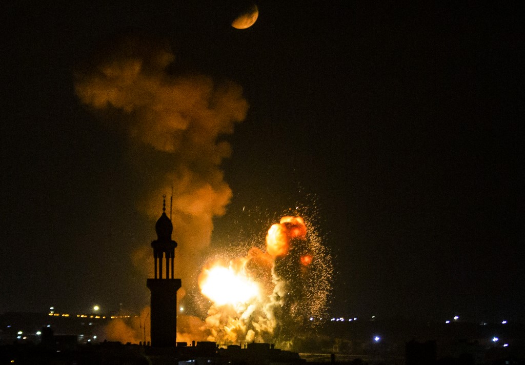 Smoke and fire rise above Khan Yunis in the southern Gaza strip, during an Israeli air strike, on 5 August 2022.