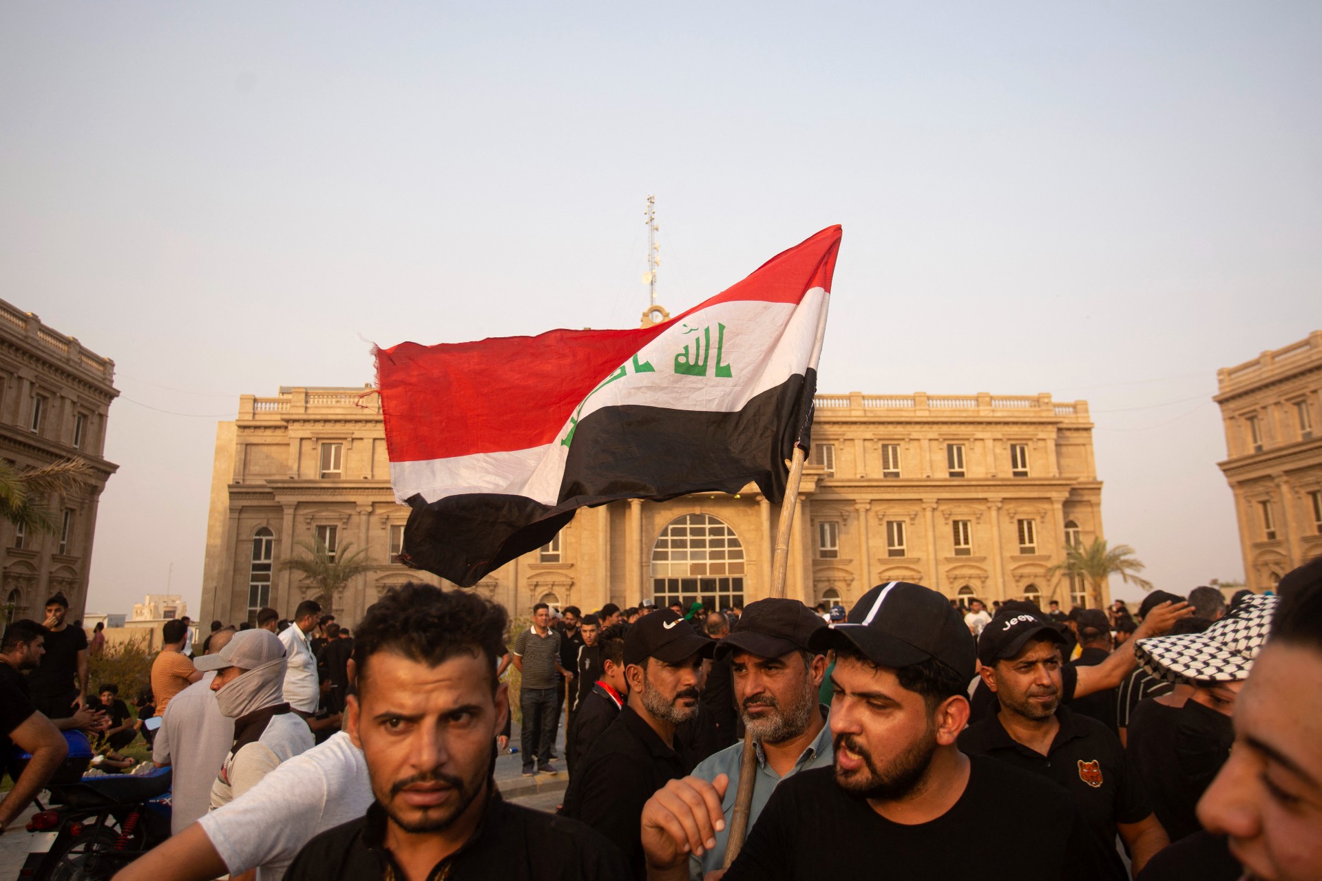 Sadr supporters outside a governmental building during a demonstration in Basra (AFP)