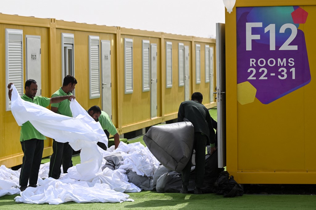 Employees prepares cabins at the Al-Emadi fan village in Doha on November 9, 2022, ahead of the Qatar 2022 FIFA World Cup football tournament. Kirill KUDRYAV