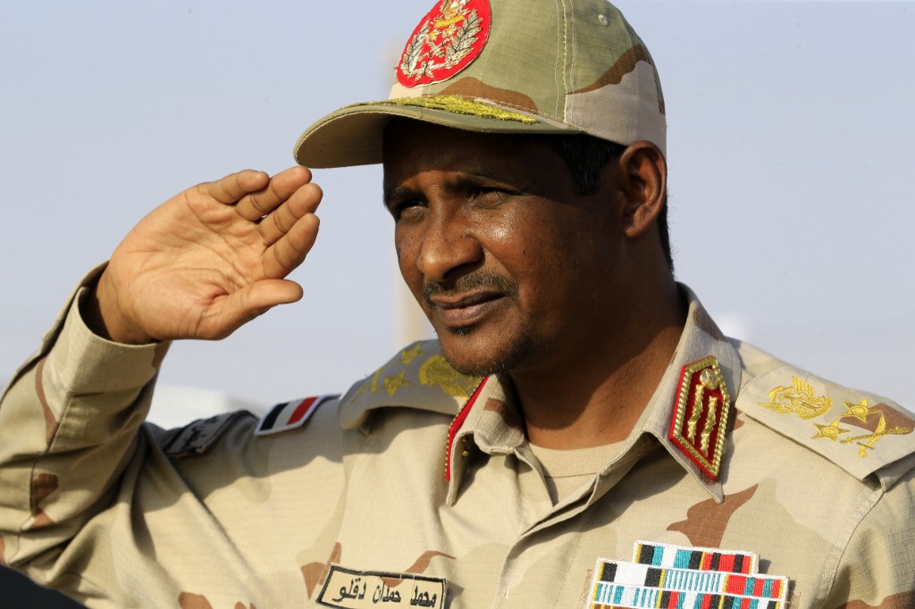 Mohamed Hamdan Daglo, leader of the large and heavily-armed paramilitary Rapid Support Forces (RSF), gives a military salute in the village of Qarri. 