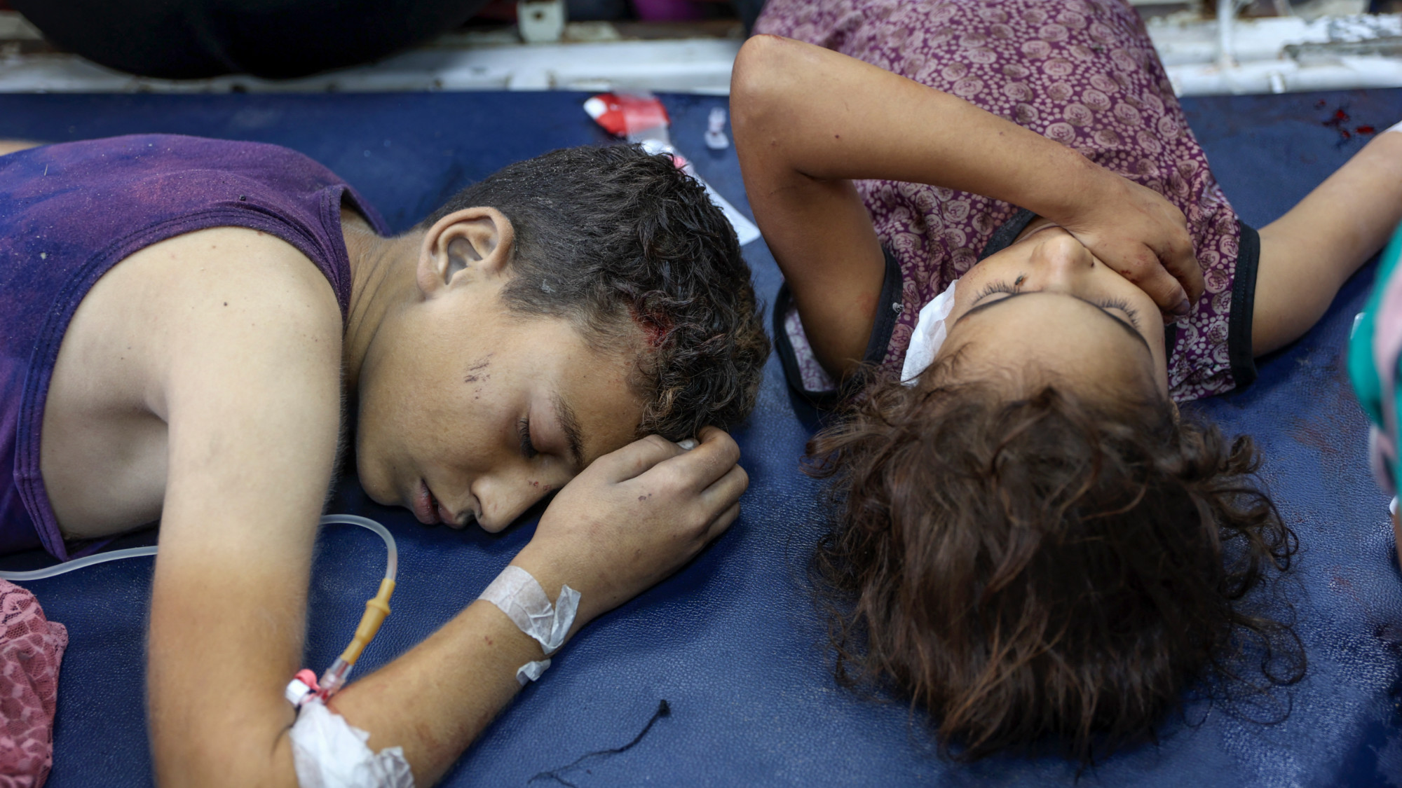 Children wounded by Israeli attacks in Jabalia refugee camp receive treatment at Al-Ahli Arab hospital in Gaza City on 21 October 2024 (AFP/Omar al-Qattaa)