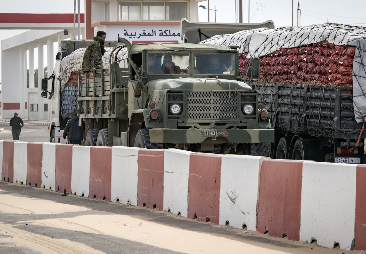 A Moroccan army vehicles drives in Guerguerat, located in the Western Sahara, on 26 November 2020 (AFP)