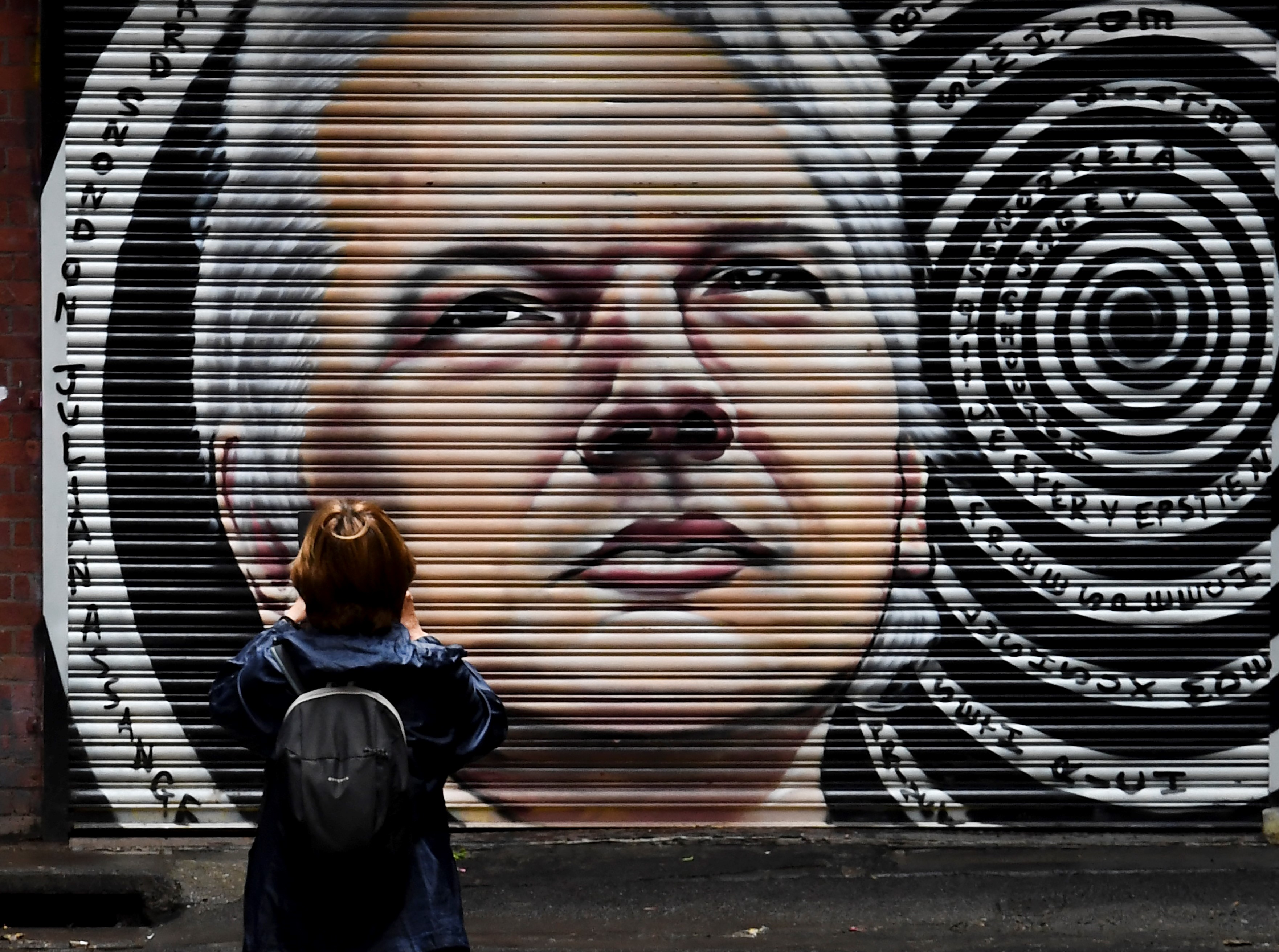 A mural of Australia's Julian Assange is seen in a laneway in Melbourne on January 5, 2021,