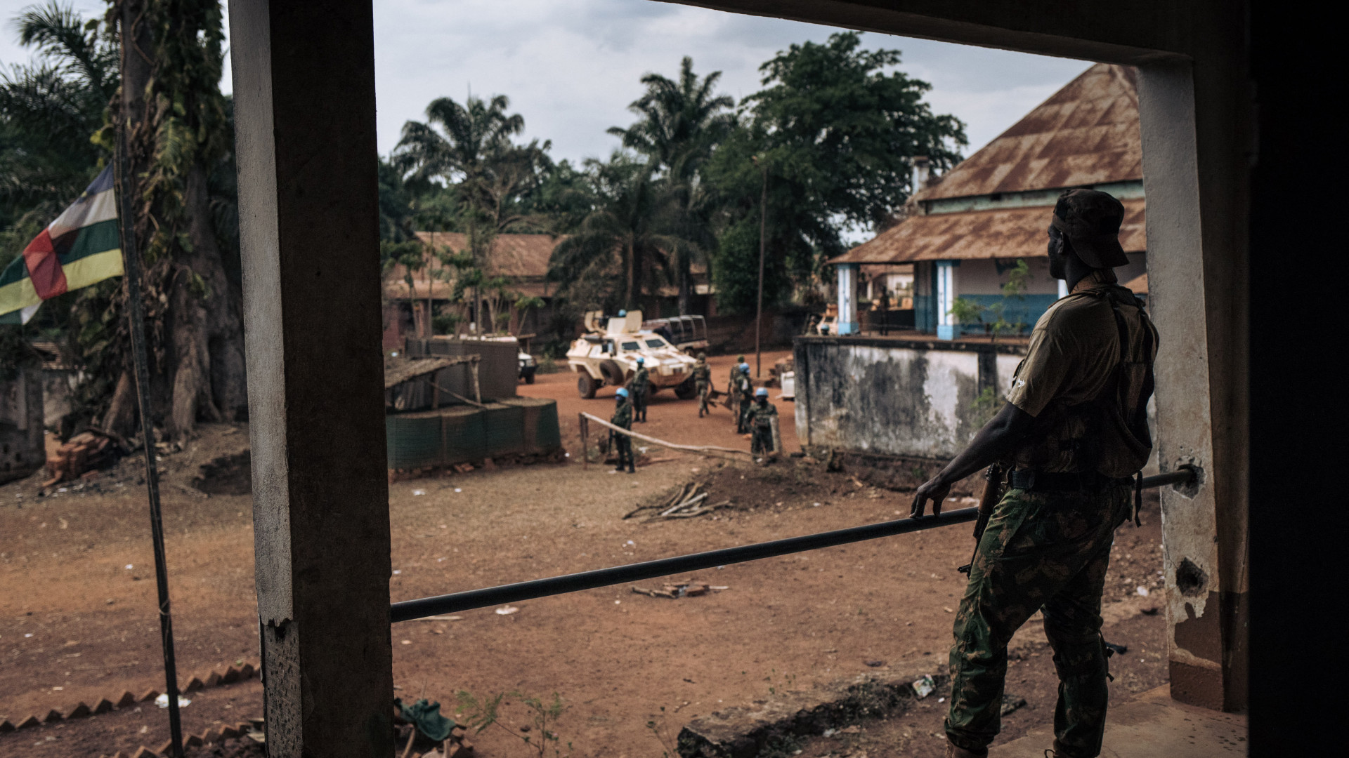 Central African Army soldiers inspect their looted military base that was occupied by rebel militiamen in Bangassou on 3 February 2021, for the first time since a 3 January 2021 attack. (AFP)