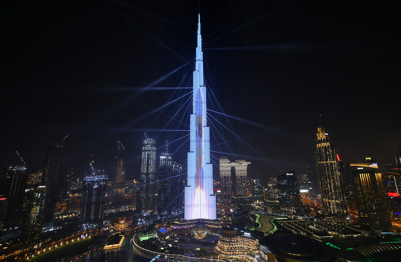 The launch of a rocket into space is projected on Dubai's Burj Khalifa on February 9, 2021 (AFP)