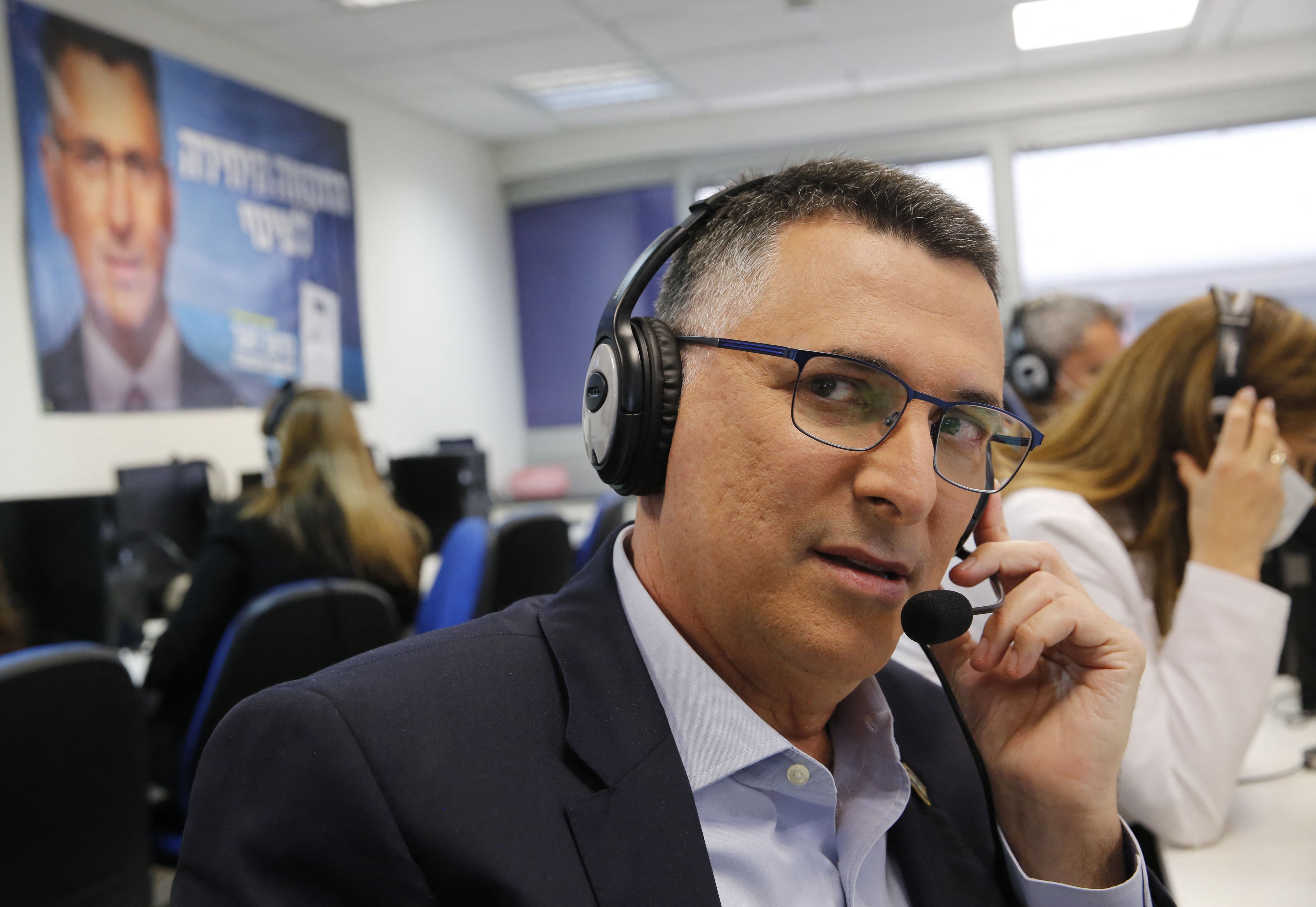 Gideon Saar, head of Israel's New Hope party, works at the party's headquarters in the Israeli coastal city of Tel Aviv on March 22, 2021, a day ahead of the election. (AFP)