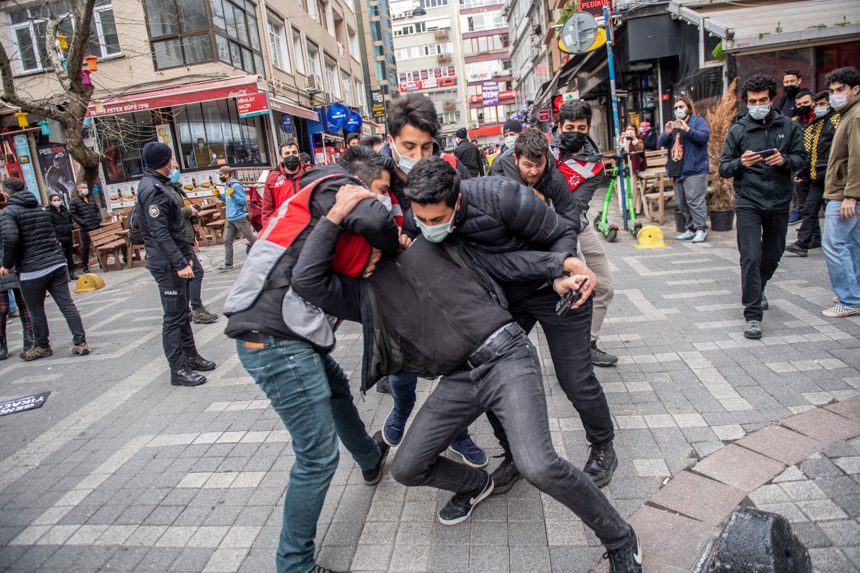 Turkish police officers detain a student during a demonstration in support of Bogazici University students, at Kadikoy in Istanbul, on April 1, 2021 (AFP)