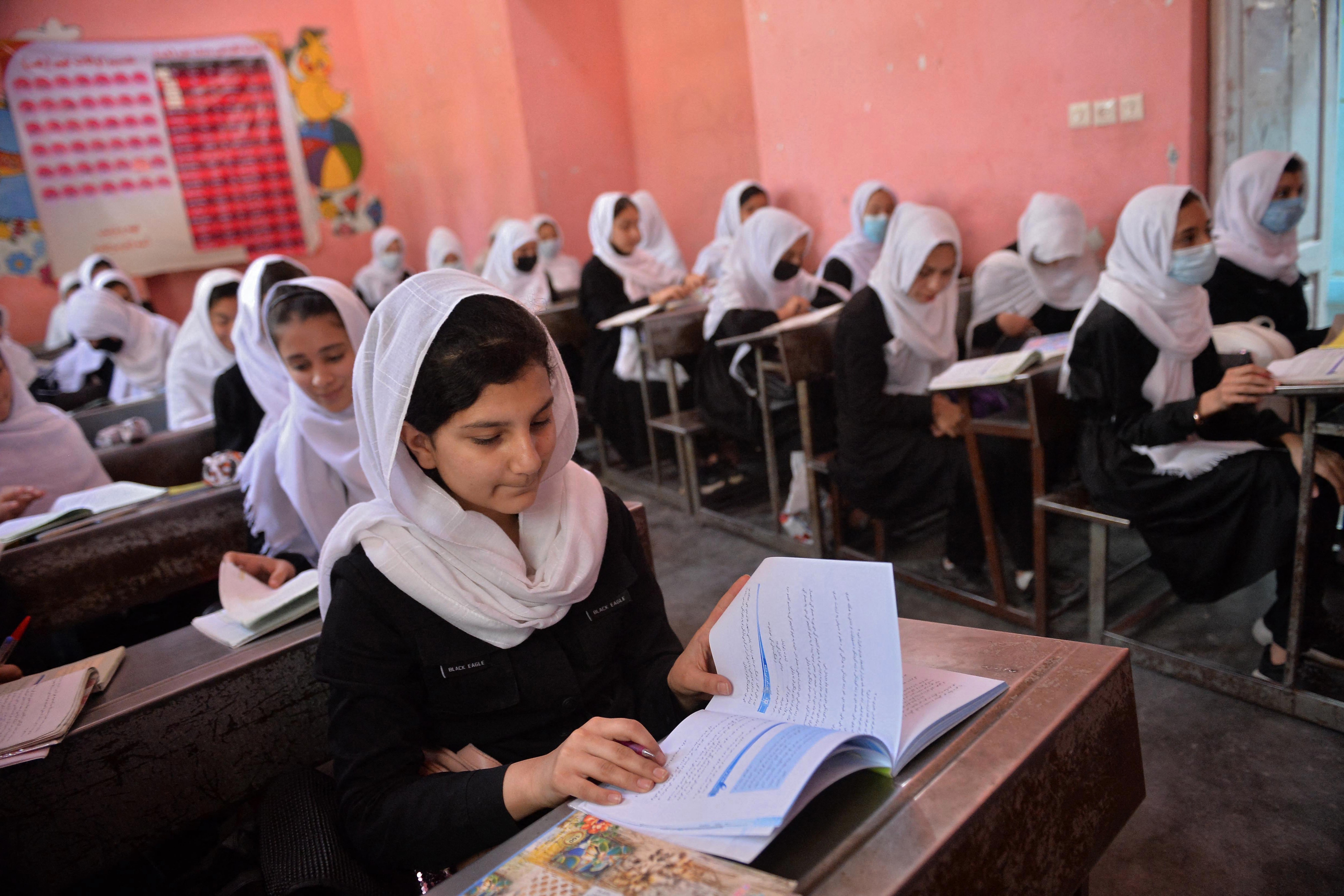 Girls attend their class at a school in Herat, Afghanistan on May 9, 2021 (AFP)