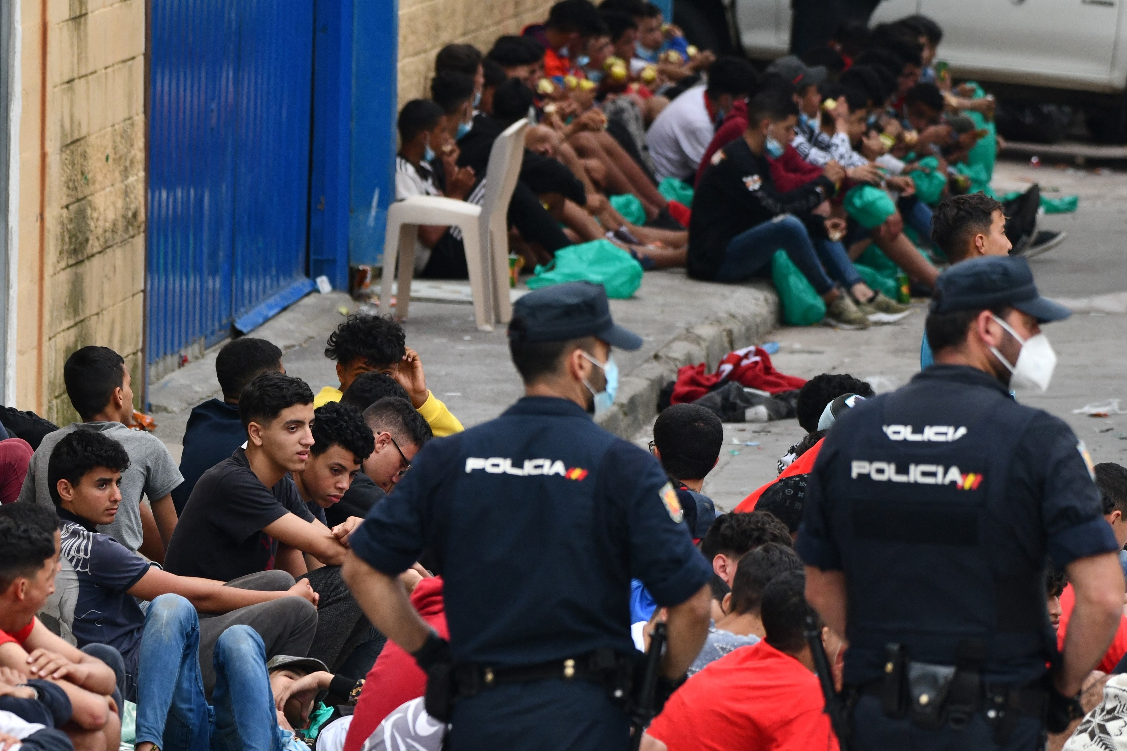 Migrant minors wait to be tested for COVID-19 upon their arrival to the Spanish enclave of Ceuta, on May 19, 2021. 