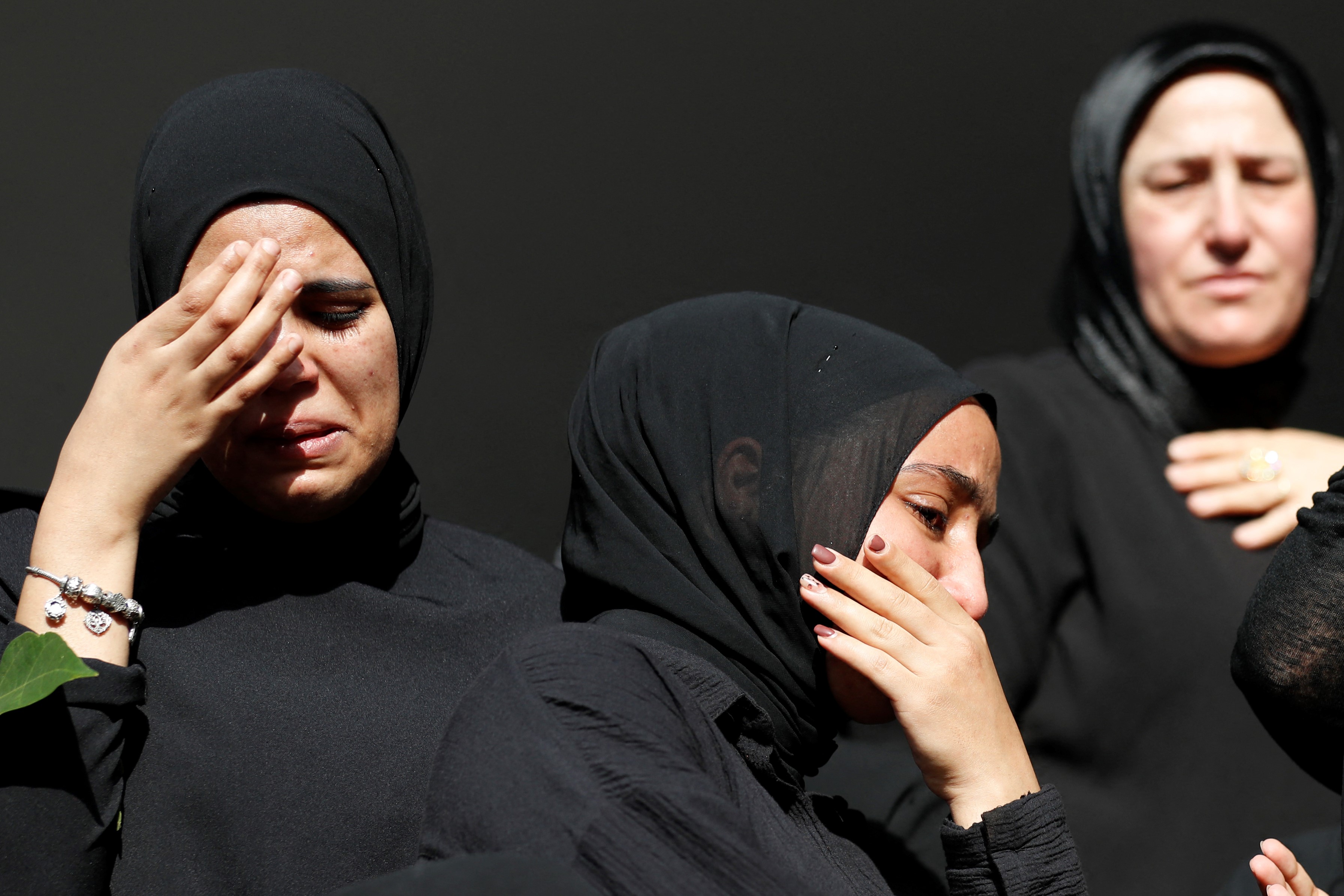 Women mourn the death of Mohammad Kiwan, a 17-year-old Palestinian who succumbed to his wounds after being shot during confrontations with Israeli troops last week, during his funeral in the mostly Arab city of Umm al-Fahm in northern Israel, on May 20, 2021.
