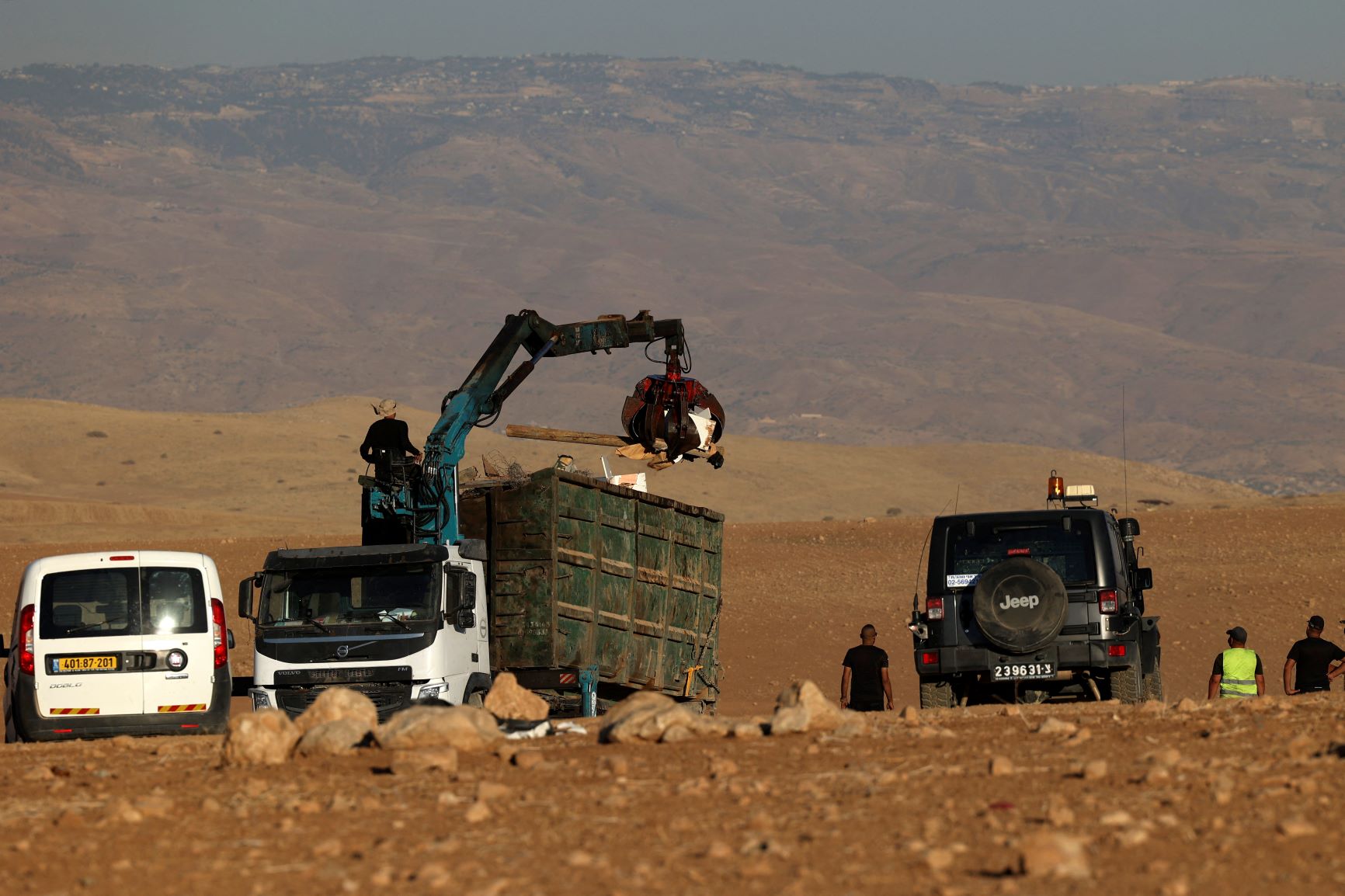 Workers dismantle tents during a demolition operation led by Israeli security forces of Khirbet Humsah (AFP)