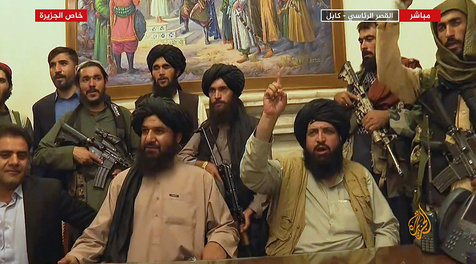 An image grab taken from Qatar-based Al-Jazeera television on August 16, 2021, shows Members of Taliban taking control of the presidential palace in Kabul