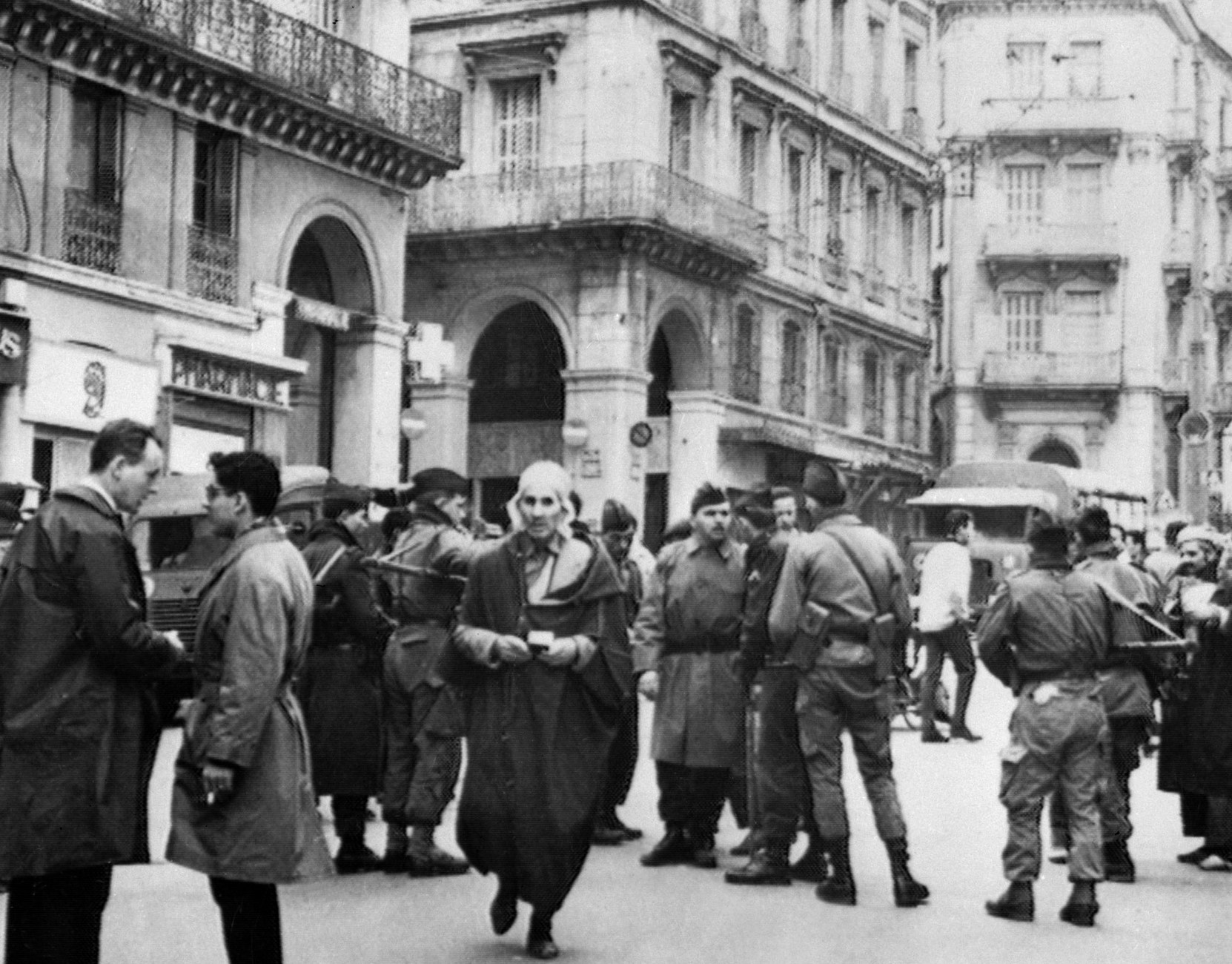 French Soldiers check the identity of Muslims at a check point on 12 December, 1960 in Algeria a few days before the UN statement acknowledging the right to the self-determination for Algerians. 