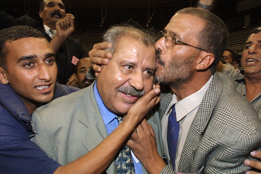 CDT founder Noubir Amaoui, centre, is pictured in Casablanca in 2001 (AFP)