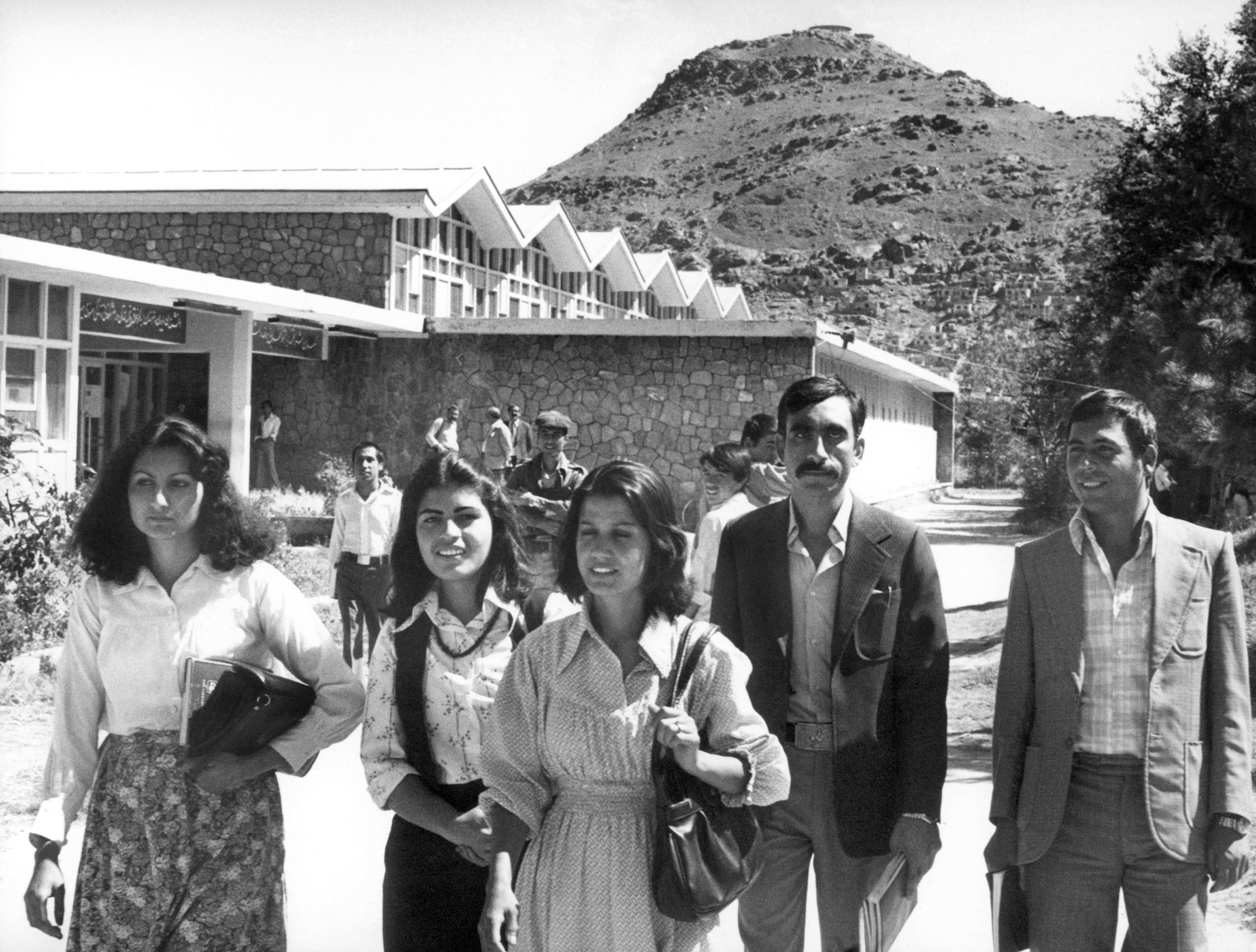 Afghan female and male students walk downtown Kabul in 1981. The Soviet troops invaded Afghanistan at the end of December 1979.