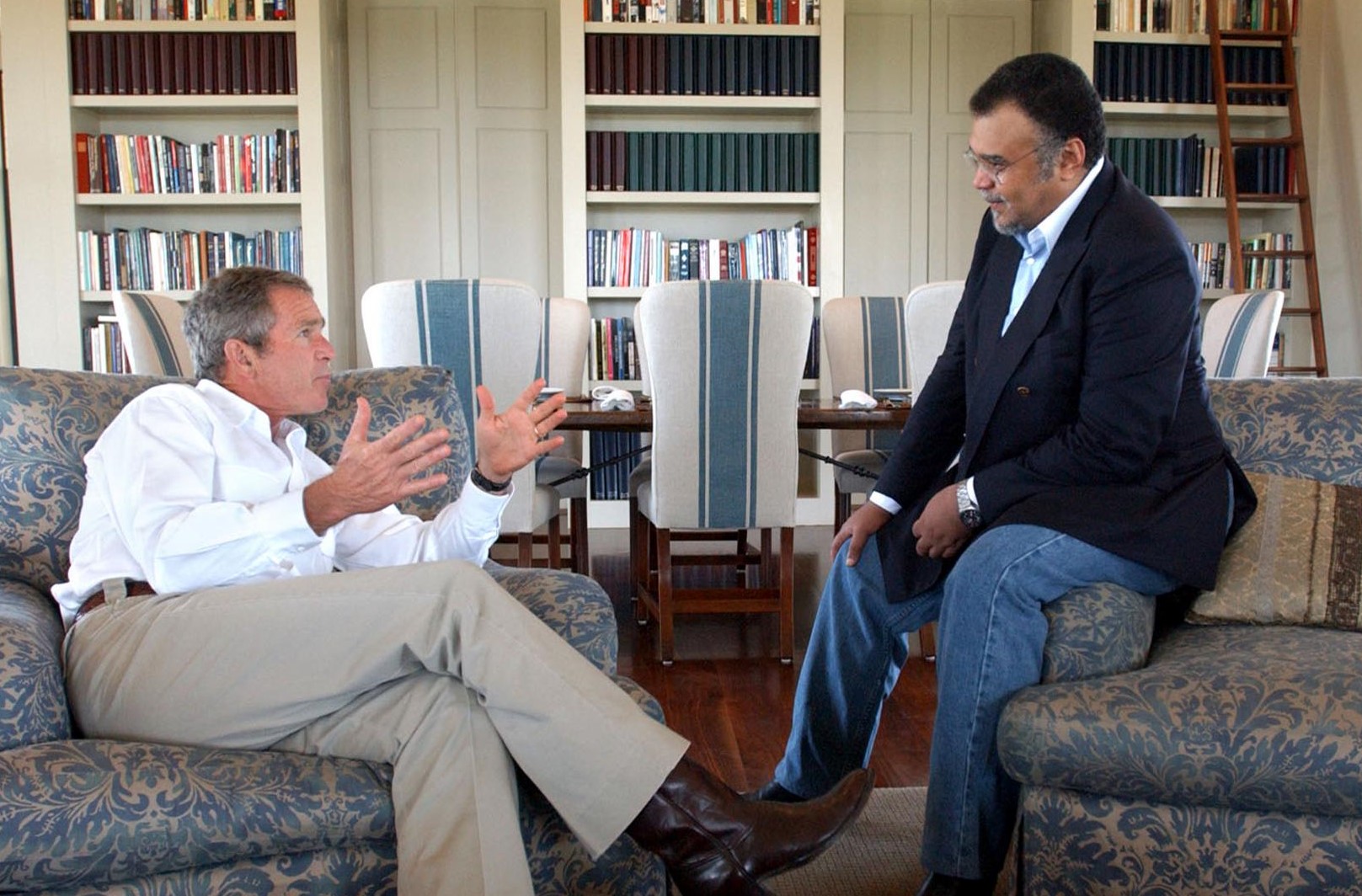  US President George W. Bush (L) meets with Saudi Arabian Ambassador to the US Prince Bandar bin Sultan at the Bush Ranch 27 August 2002 in Crawford, Texas.