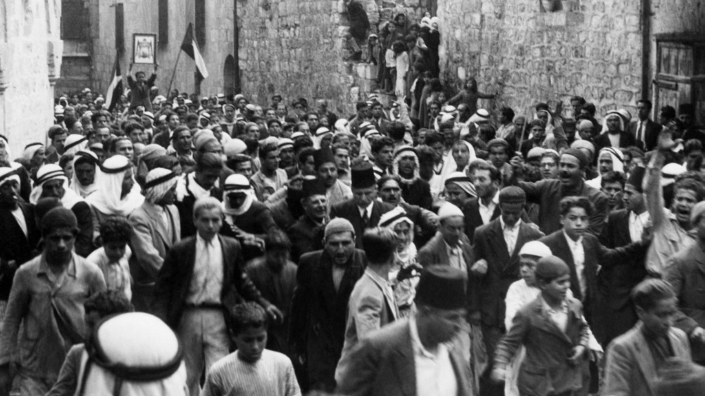 A picture dated before 1937 during the British Mandate in Palestine shows Arabs demonstrating in the Old City of Jerusalem (AFP)