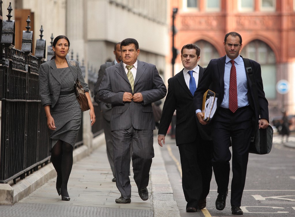Iraqi police colonel Daoud Mousa (2nd L), father of Baha Mousa, arrives for an inquiry into his son's death, in central London, on September 23, 2009 (AFP)