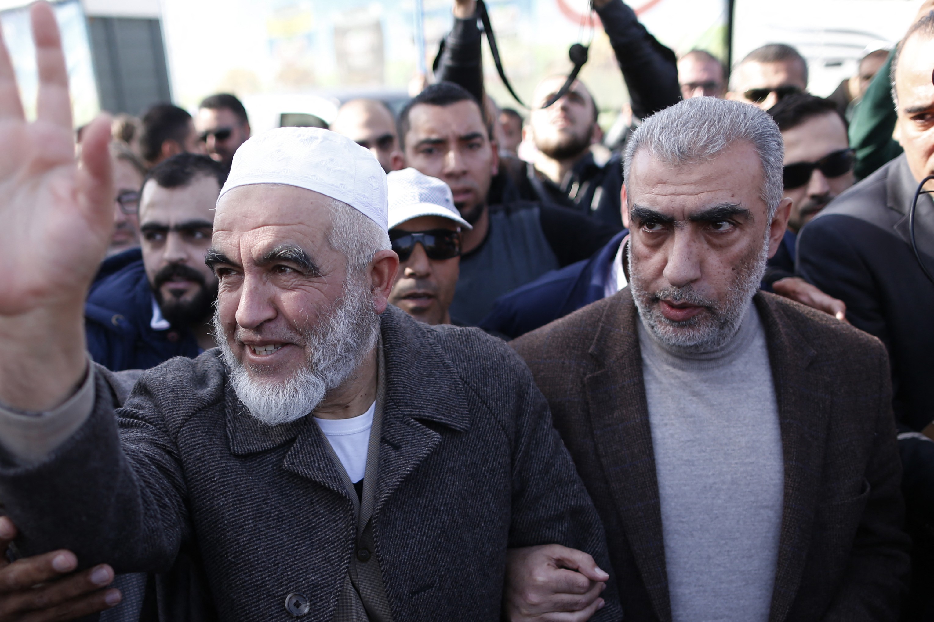 Kamal Khatib (R) at a rally with Sheikh Raed Salah (L) in Umm al-Fahm on 17 January 2017. (AFP)