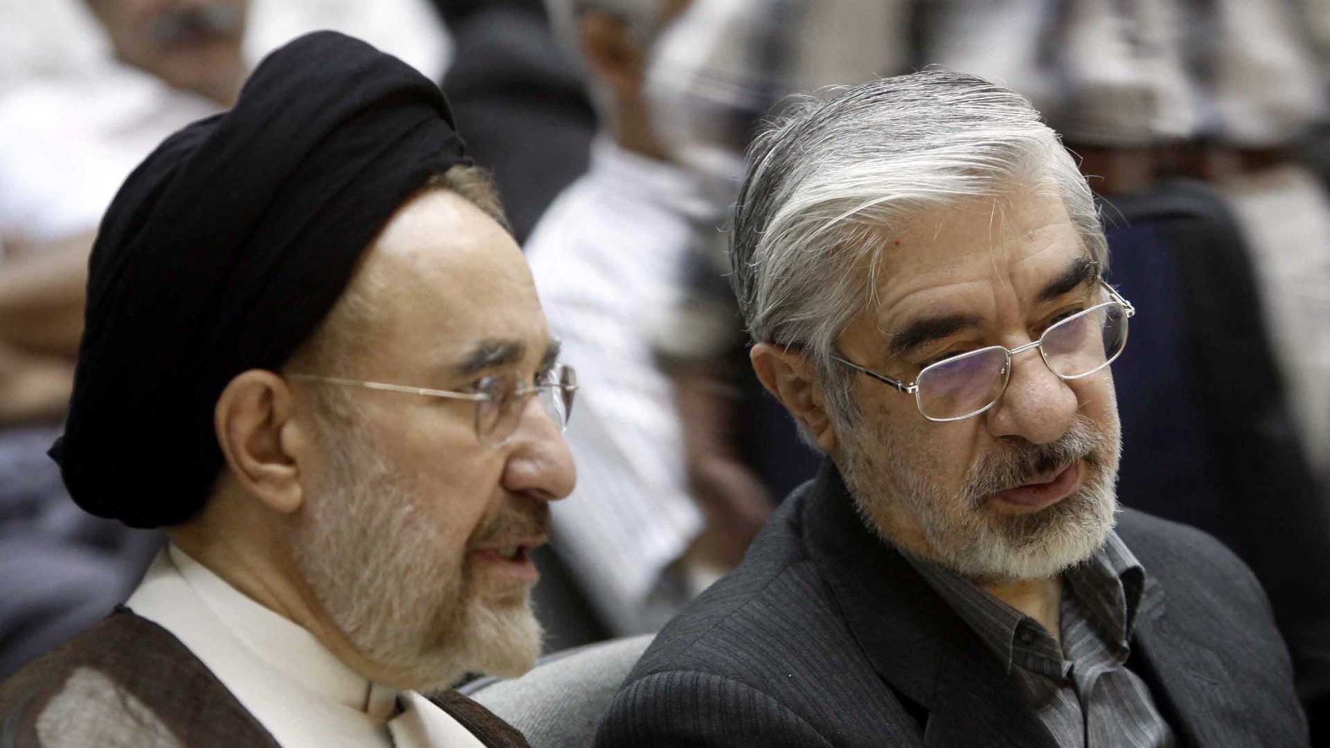 Mir Hossein Mousavi, right, and Mohammad Khatami in 2009. Their views have now diverged (AFP)