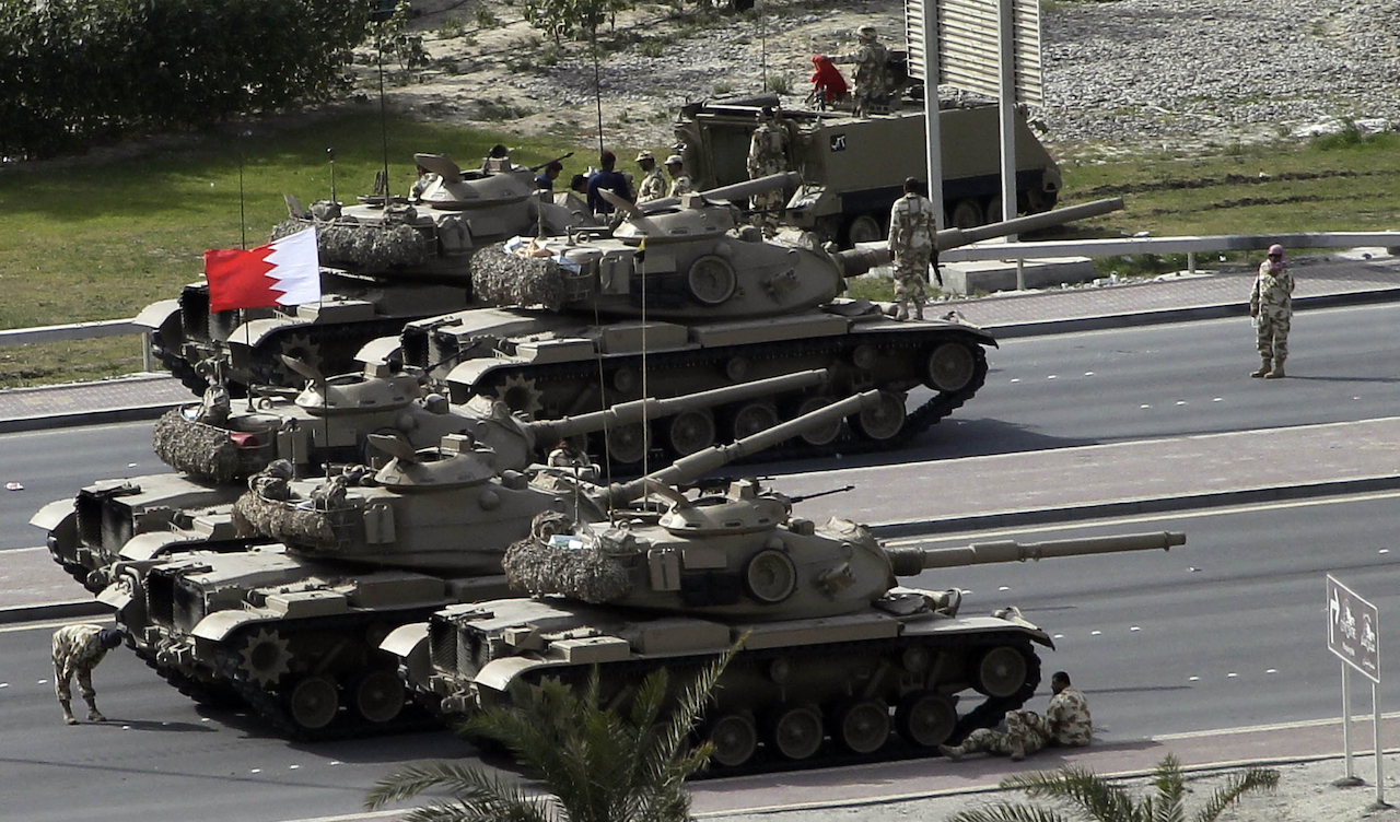 Bahraini army tanks take position near Pearl Square in Manama on February 17, 2011