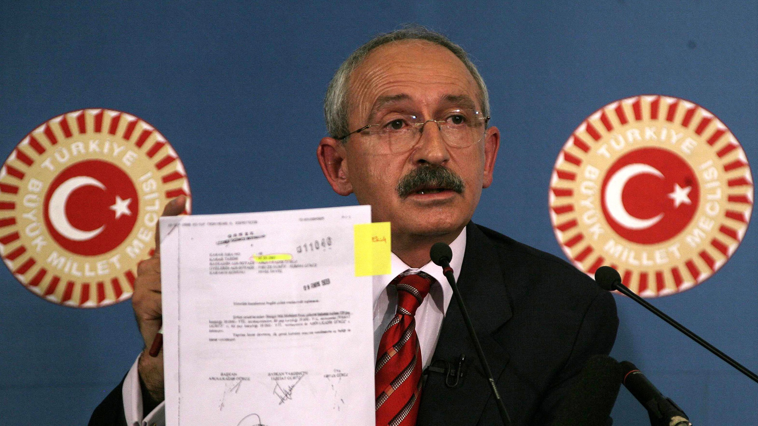Kemal Kilicdaroglu shows documents accusing Dengir Mir Mehmet Firat, during a debate on corruption at the parliament in 2008 (AFP)