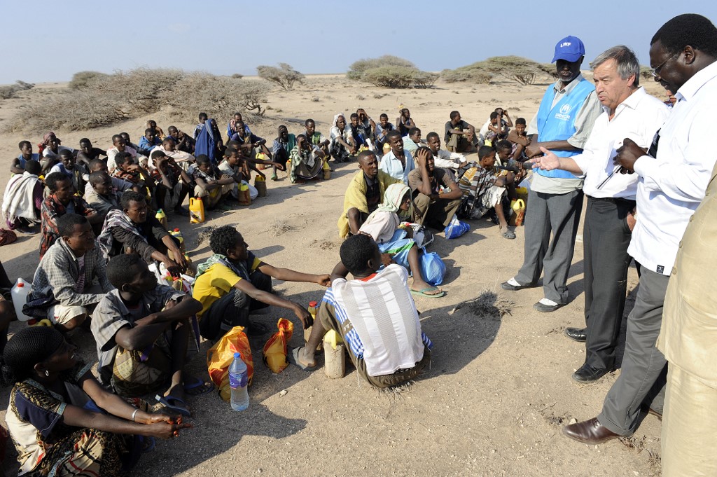 UN Secretary-General Antonio Guterres meets with Ethiopians waiting in Djibouti as they plan to cross into Yemen for Saudi Arabia (AFP)