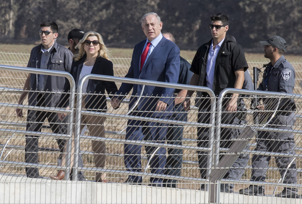 Israeli Prime Minister Benjamin Netanyahu (C) and his wife Sara (2-L) arrive for an inauguration event for the Haifa-Beit Shean railway line, on 8 November 2016 in the northen city of Afula (AFP)
