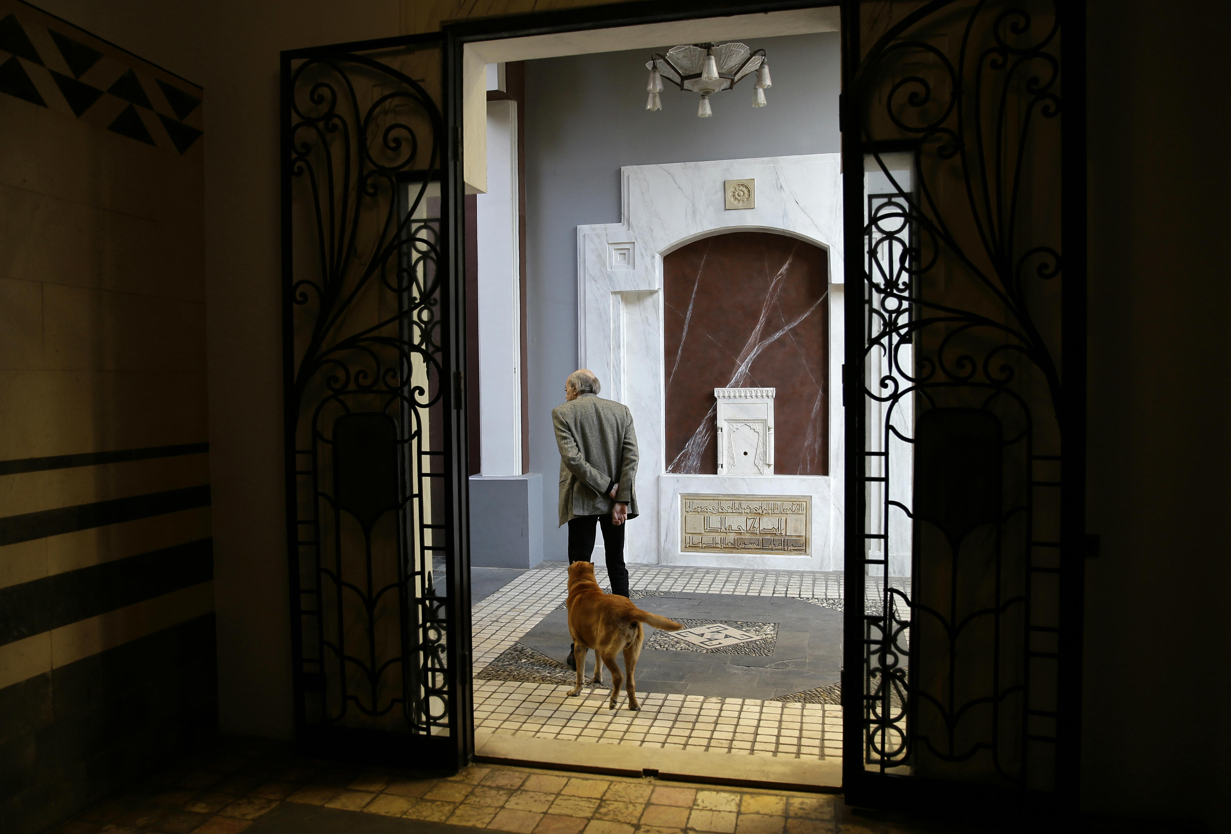 Lebanese Druze leader Walid Joumblatt walks with his Shar-Pei dog Oscar at his house in Beirut's Clemenceau street (AFP)
