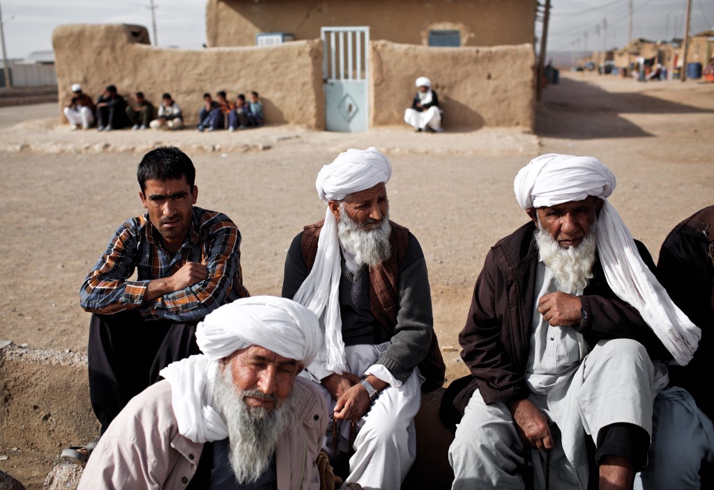 Afghan men at refugee camp in Taraz Nahid village near the city of Saveh, some 130km from Tehran (AFP) 