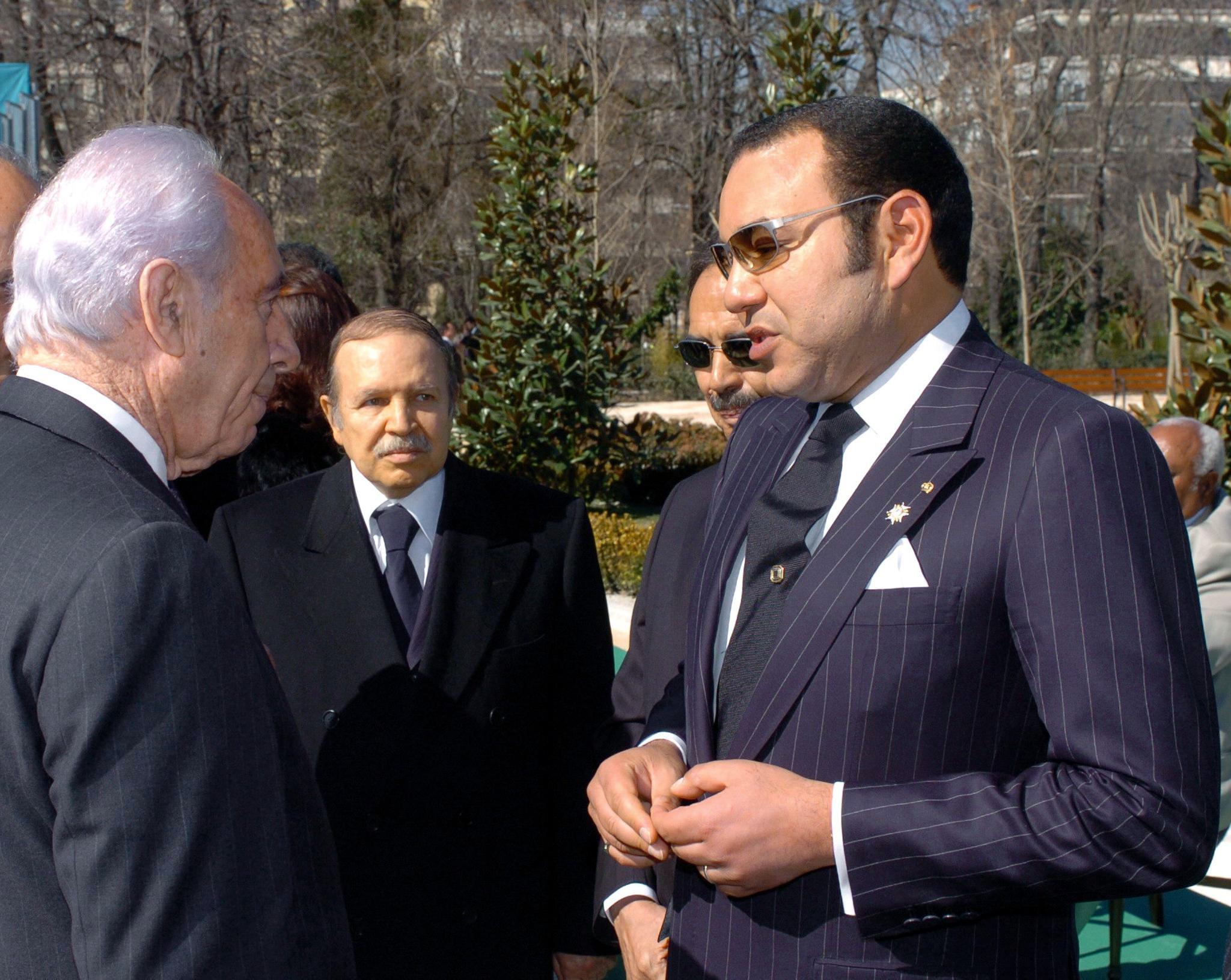King of Morocco Mohamed VI (L) chats with Israeli Deputy Prime Minister Shimon Peres (R) as President of Algeria Abdelaziz Bouteflika (C) looks on, 11 March 2005